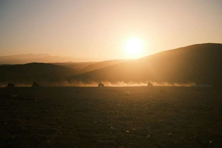 Quads racing across the Agafay Desert in Morocco