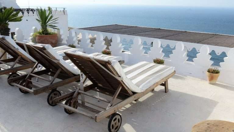 Lounge chairs on a terrace in Tangier overlooking the Atlantic Ocean