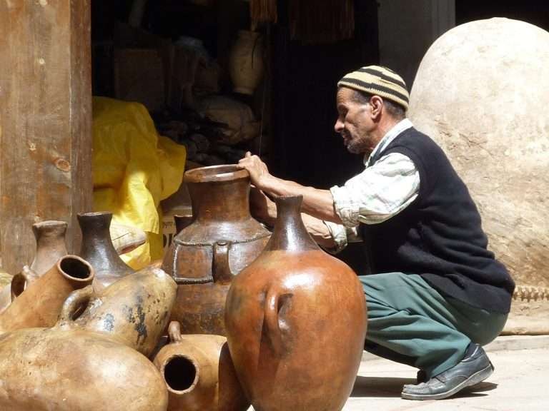 Moroccan artisan working with pottery in Marrakech