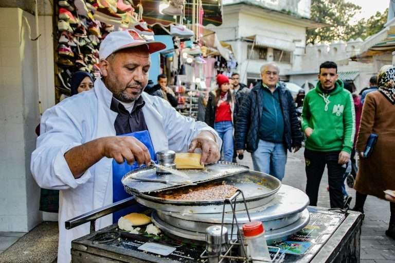 Local man cooking street food in Tangier medina