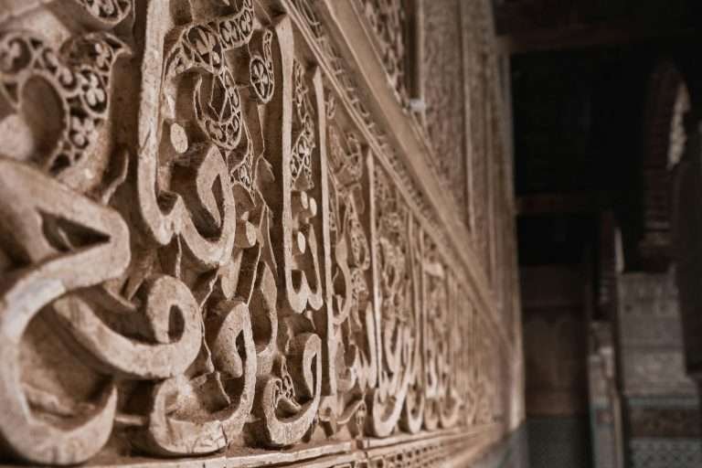 Close-up of intricate carved stone detail in Moroccan architecture
