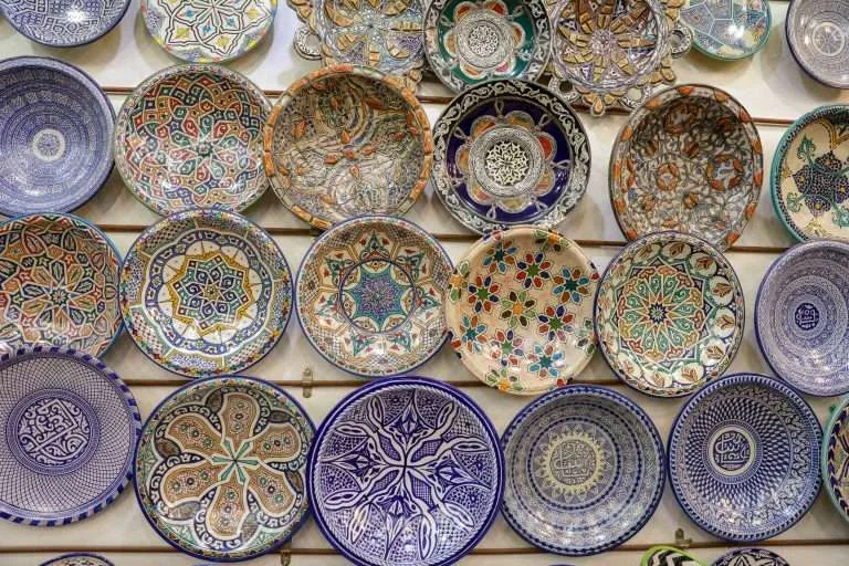 Hand-painted Moroccan ceramic plates on display in Fes