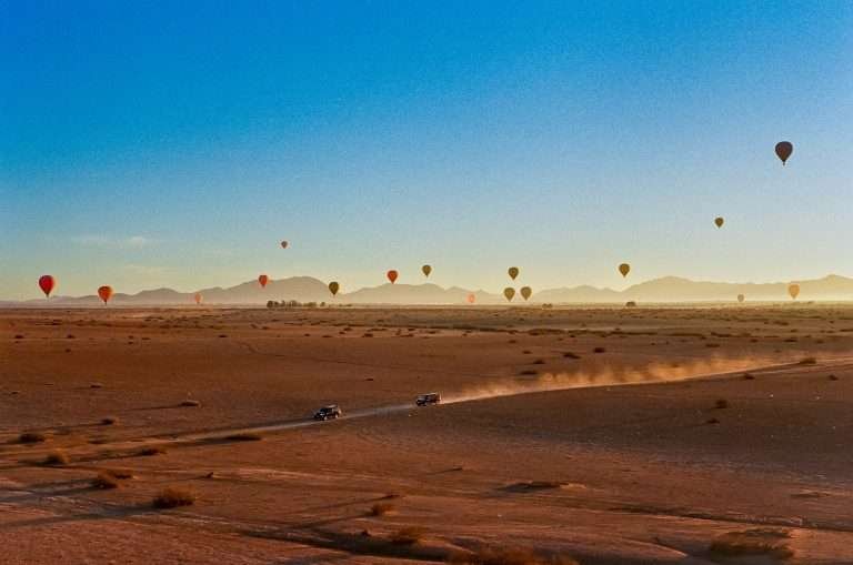 Hot air balloons over the Marrakech desert at sunrise