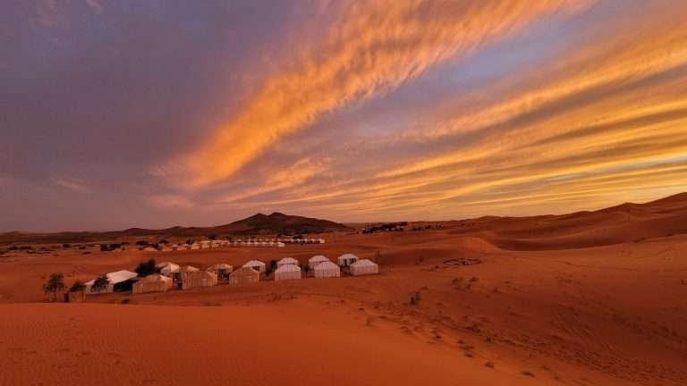 Desert camp at sunset in the Sahara, Morocco
